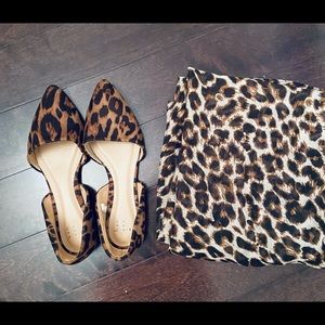 Woman’s flat animal print shoes and scarf